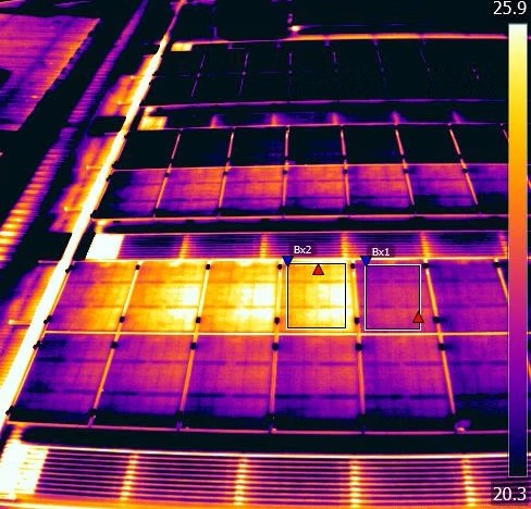 Thermal imagery scan showing heat signatures on a building